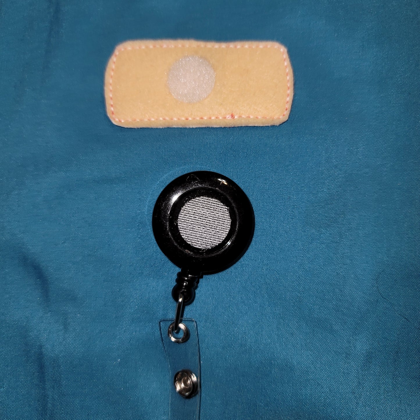 Bandaid Coral Glitter Badge Reel