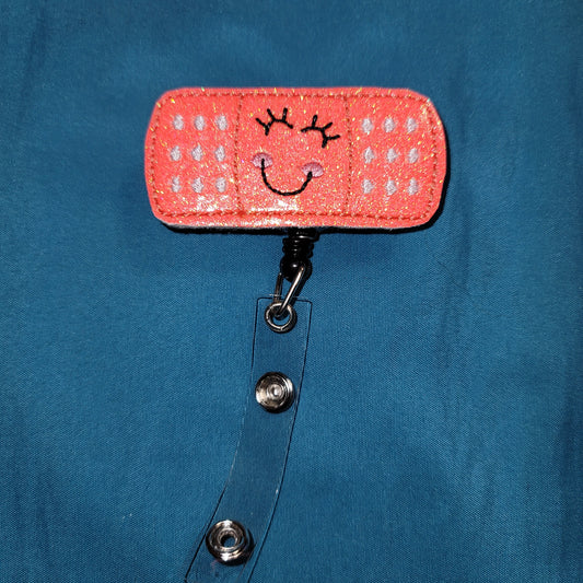 Bandaid Coral Glitter Badge Reel